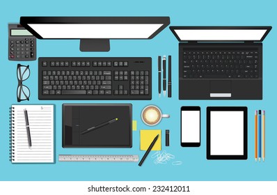 Workplace with notebook, Tablet, Smart Phone, Graphics Tablet, keyboard, and cup of coffee on work table. Above view shot.