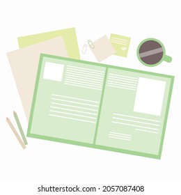 Lugar de trabajo. Un lugar para estudiar. Un libro abierto, una taza de café, membretes, pegatinas, lápices. El concepto de capacitación o trabajo de oficina.