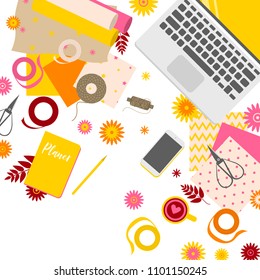 Workplace of scrapbooking master, view from above, desktop, paper, flowers and laptop 