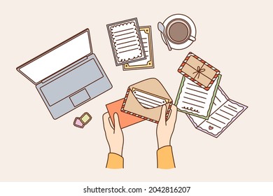 Workplace space and table concept. Top view of human hands sending postcard in envelope on working table vector illustration 