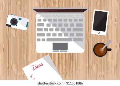 Workplace. The view from the top. Laptop, camera, smart phone, list of ideas. Great for web, cards, posters.