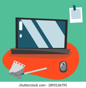 Workspace of a developer, designer, mouse carpet, notebook, pen and a photograph with a tape on a wall. Distance online work, education, learning. 