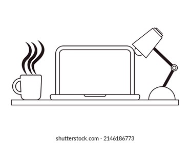 Workspace with laptop, lamp and cup.