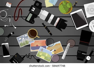 Workspace of photographer. Top view with gray table, photo camera, lens, smartphone, tablet and coffee cup. Flat design. Vector illustration with clipping mask.