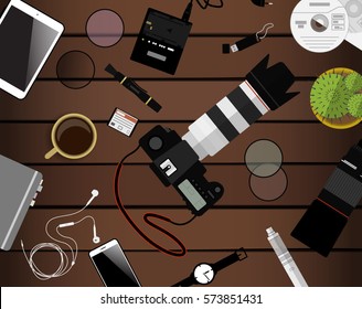 Workspace of photographer. Top view with textured table, photo camera, lens, smartphone, notepad and coffee cup. Flat design. Vector illustration with clipping mask.