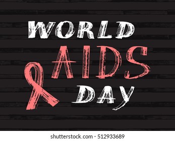 World Aids Day concept with text and red ribbon of aids awareness. 1st December. Grunge brush strokes lettering