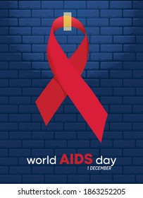 World AIDS Day post in front of a blue brick wall. AIDS day message hanging on a red ribbon. Poster Design. Blue brick wall background.