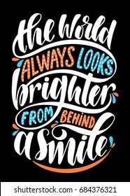 The world always looks brighter from behind a smile.Inspirational quote.Hand drawn illustration with hand lettering.