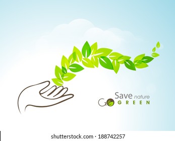 World Environment Day concept with green leaves coming out from human hand on blue background. 