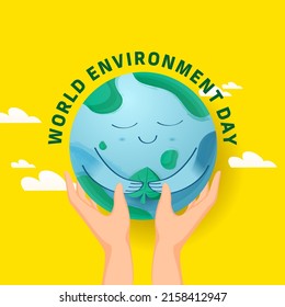 World Environment Day Concept With Human Hands Holding Smiley Earth Globe On Yellow Background.