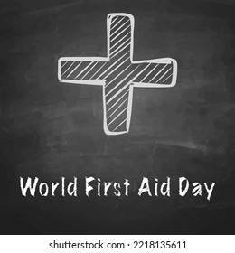 World First Aid Day Drawn With Chalk On A Dark Blackboard.
