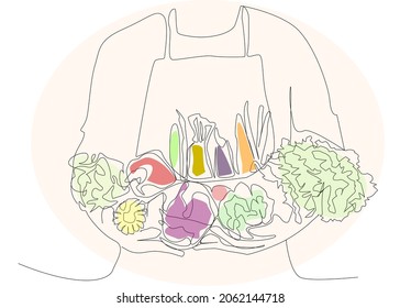 world food day concept.Man wearing apron holding various vegetables in both hands. Healthy food and vegan day concept. 