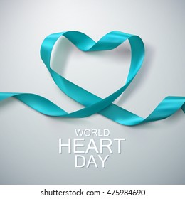 World Heart Day Background. Realistic satin ribbon heart with World Heart Day label. Vector illustration. Medical awareness day concept