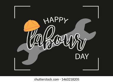 World Labour Day concept with working tools, wrenches and hammer with stylish text on black background.