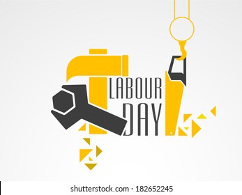 World Labour Day concept with working tools, wrenches and hammer with stylish text on grey background. 