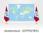 World Map between two hanging flags of Arkansas on flag stand. Vector illustration for diplomacy meeting, press conference and other.