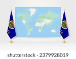 World Map between two hanging flags of Kansas on flag stand. Vector illustration for diplomacy meeting, press conference and other.
