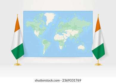 World Map between two hanging flags of Ivory Coast on flag stand. Vector illustration for diplomacy meeting, press conference and other.