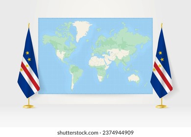 World Map between two hanging flags of Cape Verde on flag stand. Vector illustration for diplomacy meeting, press conference and other.