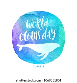 World oceans day emblem - brush calligraphy and whale silhouette on a watercolor circle background. Vector illustration.