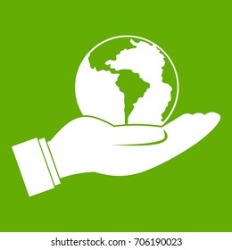 World planet in man hand icon white isolated on green background. Vector illustration