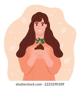 World Soil Day is held annually on December 5. The girl is holding a green plant in her hands. Forest restoration, reforestation planting trees, environment day.