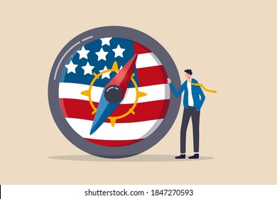 World And United States Economic Direction After Presidential Election, Direction Of US Federal Reserve, FED In Financial Crisis Concept, Businessman Leader Stand With Compass With USA National Flag.