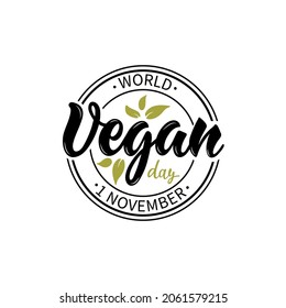 World Vegan day 1 November stamp isolated on white background. Modern brush ink calligraphy. Hand lettering design for card, sticker, logotype, print. Vector illustration with text and green leaves