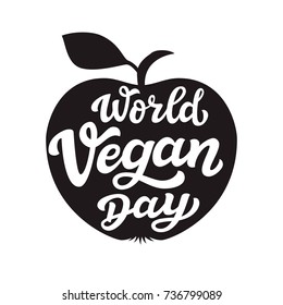 World vegan day. International november holiday. Hand drawn lettering typography with apple silhouette. Vector calligraphy for posters, web sites, cards, t shirts, party decor
