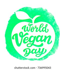 World vegan day. International november holiday. Hand drawn lettering typography with apple silhouette on watercolor background. Vector calligraphy for posters, web sites, cards, t shirts, party decor