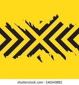 Worn black chevron style stripes over a yellow background.