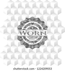 Worn grey badge with geometric cube white background