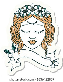worn old sticker with banner of female face with third eye