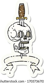 worn old sticker with banner of a skull