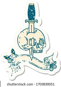 worn old sticker with banner of a skull