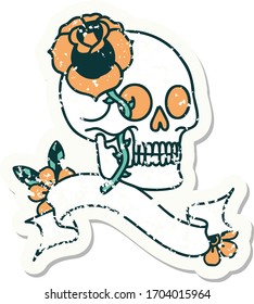 worn old sticker with banner of a skull and rose