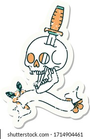 worn old sticker with banner of a skull
