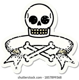 worn old sticker with banner of a skull