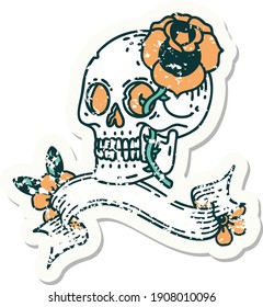 worn old sticker with banner of a skull and rose