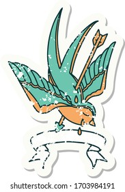 worn old sticker with banner of a swallow pierced by arrow