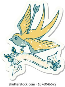 worn old sticker with banner of a swallow