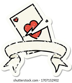worn old sticker with banner of a torn card
