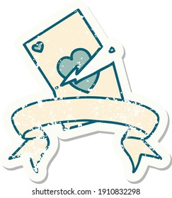worn old sticker with banner of a torn card