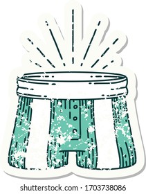 worn old sticker of a tattoo style pair of shorts