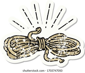 worn old sticker of a tattoo style wound rope