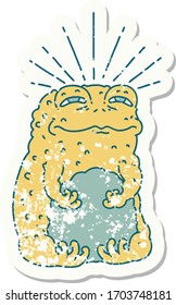 worn old sticker of a tattoo style toad character