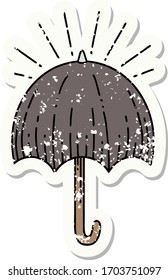 worn old sticker of a tattoo style open umbrella