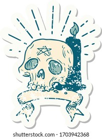 worn old sticker of a tattoo style spooky skull and candle