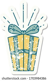 worn old sticker of a tattoo style christmas present