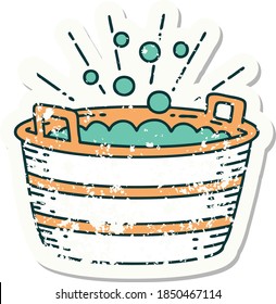 worn old sticker of a tattoo style tin bath